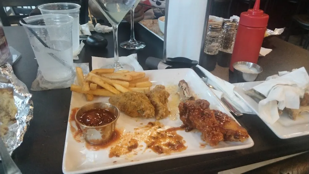 Sweet Heat and Lemon Pepper Wings with Fries and Corn Bread